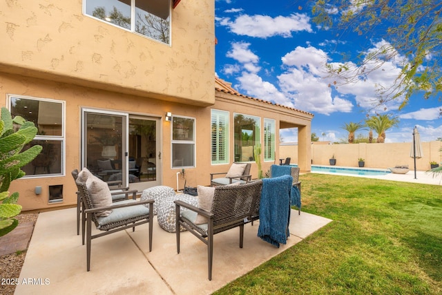 view of patio featuring fence and a fenced in pool