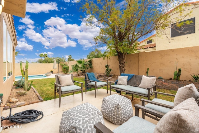 view of patio featuring a fenced backyard, an outdoor living space, and a fenced in pool