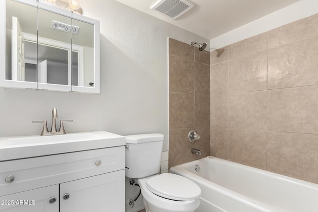 bathroom with visible vents, toilet, bathtub / shower combination, and vanity