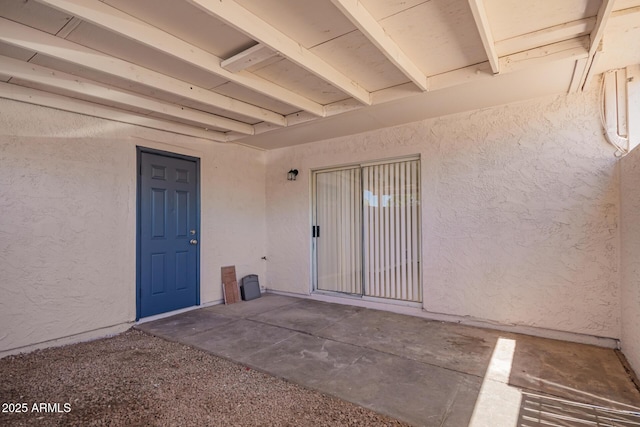 doorway to property featuring a patio