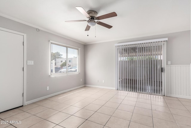 unfurnished room with light tile patterned floors, baseboards, a ceiling fan, and ornamental molding