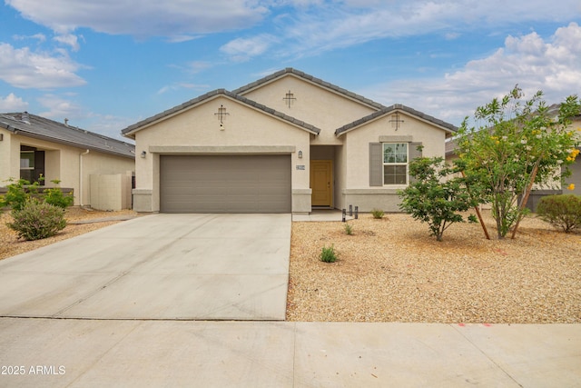 23934 W Verlea Dr, Buckeye, AZ 85326 - view of front of house with stucco siding, a garage, and concrete driveway