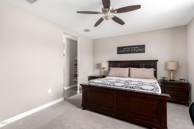 23934 W Verlea Dr, Buckeye, AZ 85326 - bedroom with light carpet, baseboards, and a ceiling fan