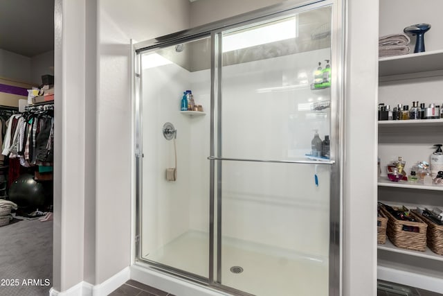 23934 W Verlea Dr, Buckeye, AZ 85326 - bathroom featuring a shower stall and a walk in closet