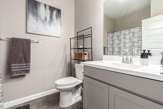 23934 W Verlea Dr, Buckeye, AZ 85326 - full bath featuring baseboards, vanity, toilet, wood finished floors, and a shower with shower curtain