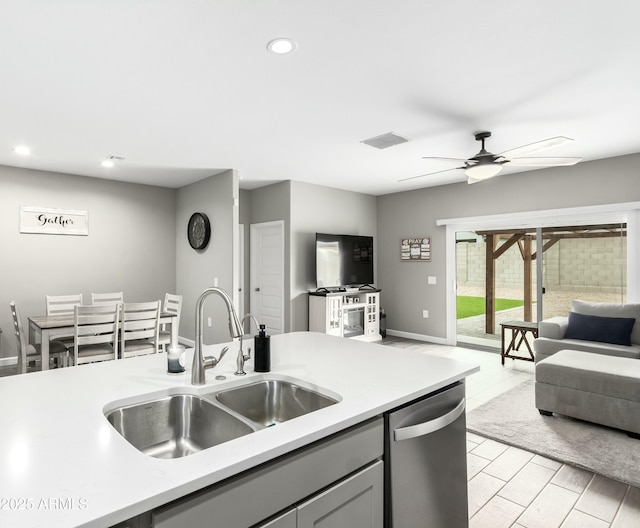 23934 W Verlea Dr, Buckeye, AZ 85326 - kitchen featuring a sink, stainless steel dishwasher, open floor plan, recessed lighting, and light countertops