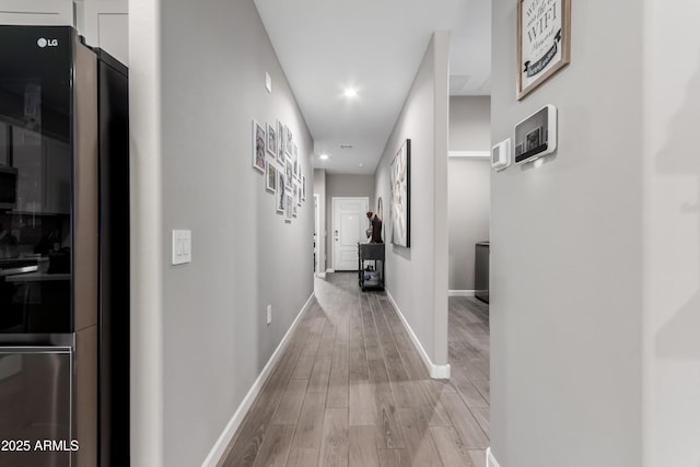 23934 W Verlea Dr, Buckeye, AZ 85326 - corridor featuring light wood-style flooring, baseboards, and recessed lighting