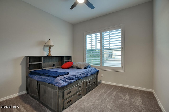 bedroom featuring ceiling fan and carpet