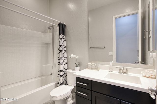 full bathroom with toilet, vanity, and shower / bath combo with shower curtain