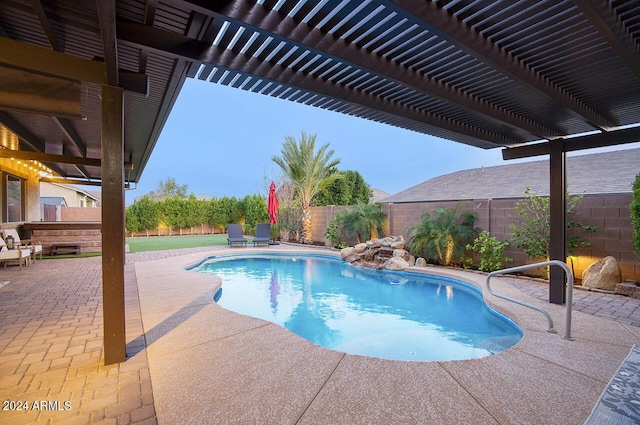 view of pool with a patio area and a pergola