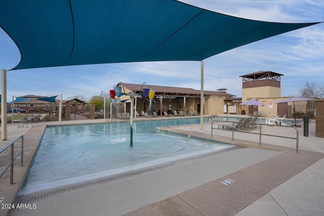 view of swimming pool featuring a patio area