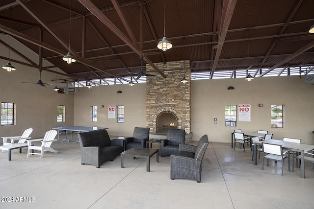 view of patio with an outdoor living space with a fireplace