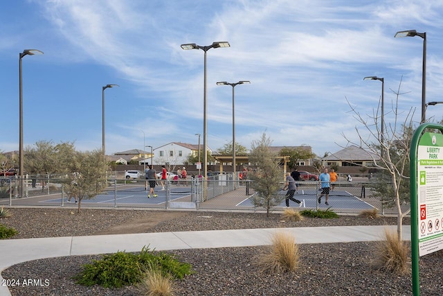 view of community with tennis court