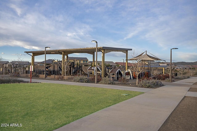 view of playground with a lawn