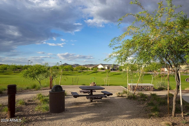 view of property's community with a yard