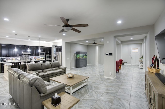 living room featuring ceiling fan