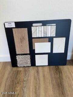 24263 W Southgate Ave, Buckeye, AZ 85326 - detailed view of baseboards and wood finished floors