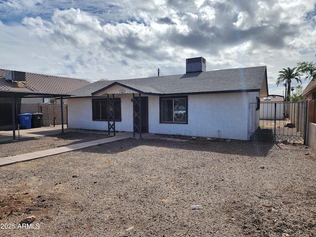 view of front of property with a gate and fence