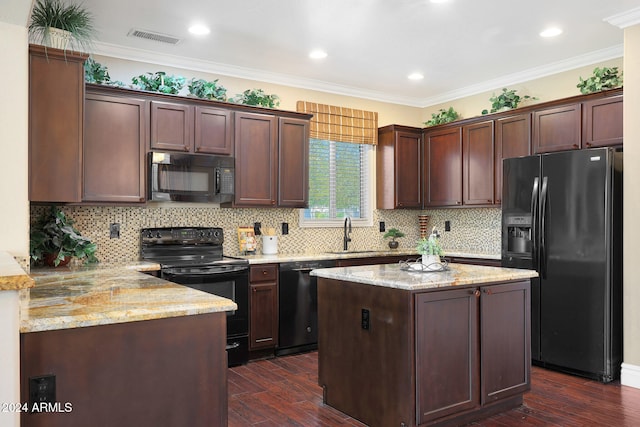 kitchen with black appliances, sink, ornamental molding, dark hardwood / wood-style flooring, and kitchen peninsula