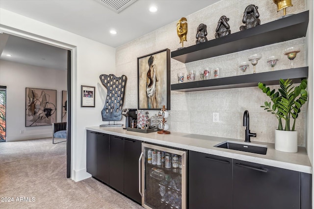 bar with light carpet, wine cooler, and sink