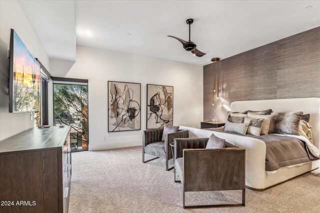 bedroom with access to exterior, ceiling fan, and light colored carpet