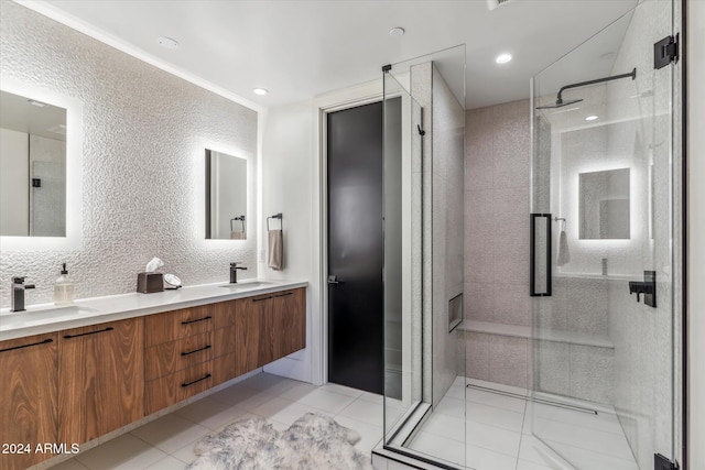 bathroom featuring vanity, tile patterned floors, and a shower with shower door