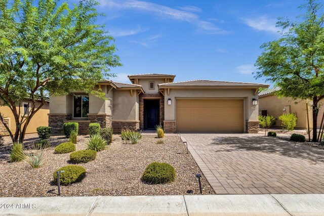 prairie-style home featuring a garage