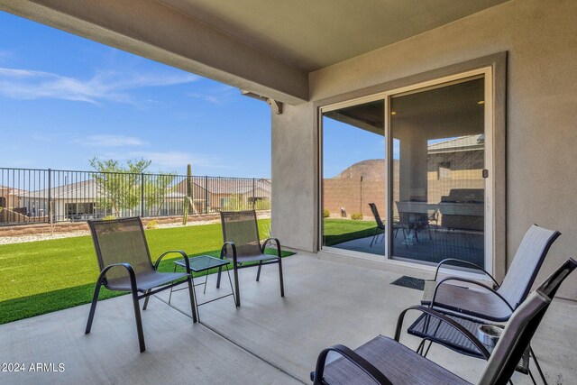 view of patio / terrace featuring fence