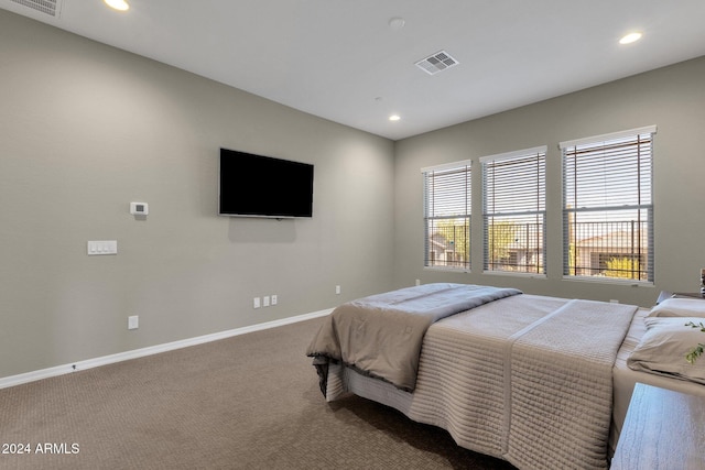 bedroom featuring carpet floors, recessed lighting, visible vents, and baseboards