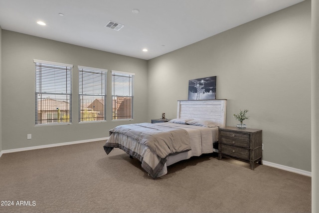 bedroom featuring carpet floors, recessed lighting, visible vents, and baseboards