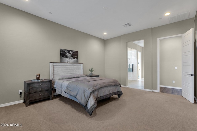 carpeted bedroom featuring recessed lighting, visible vents, and baseboards