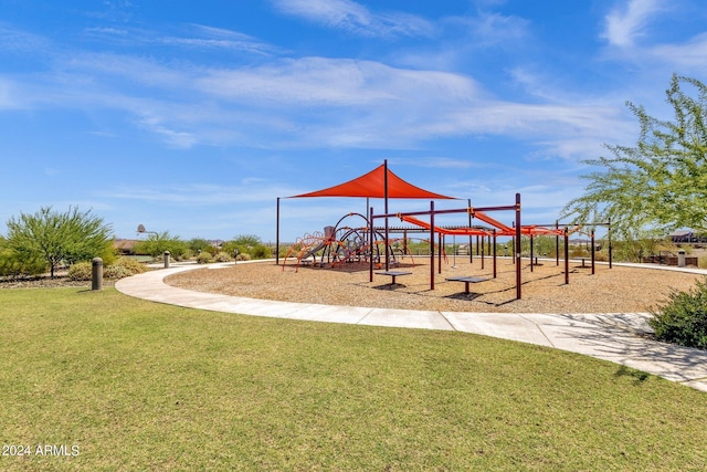 communal playground featuring a lawn