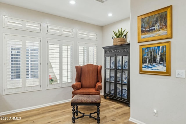 sitting room featuring recessed lighting, baseboards, and wood finished floors