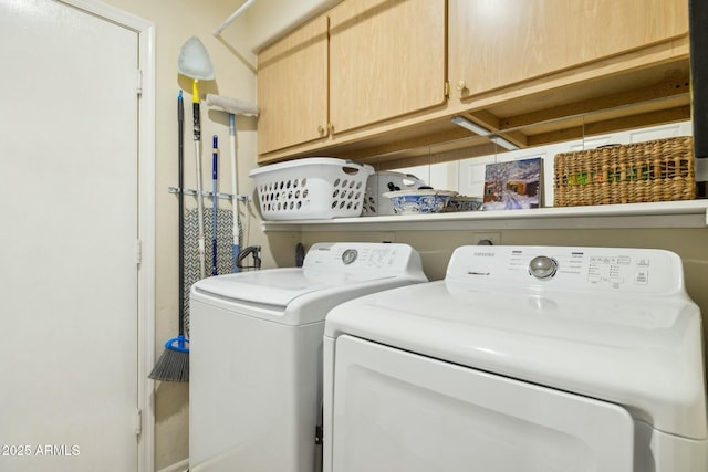 laundry room featuring cabinet space and washing machine and dryer