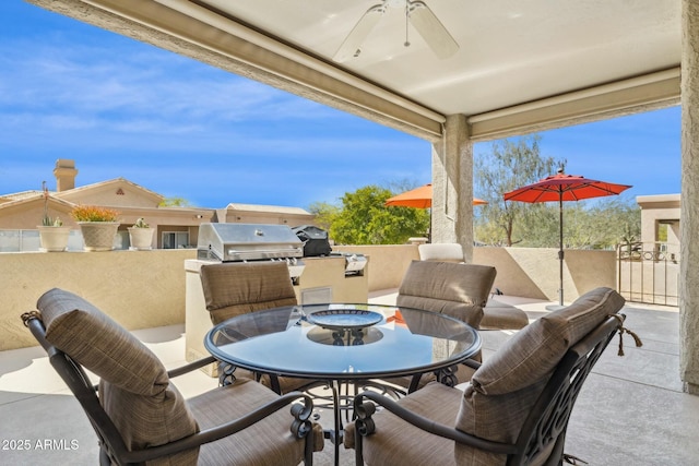 view of patio / terrace with a grill, ceiling fan, and outdoor dining space