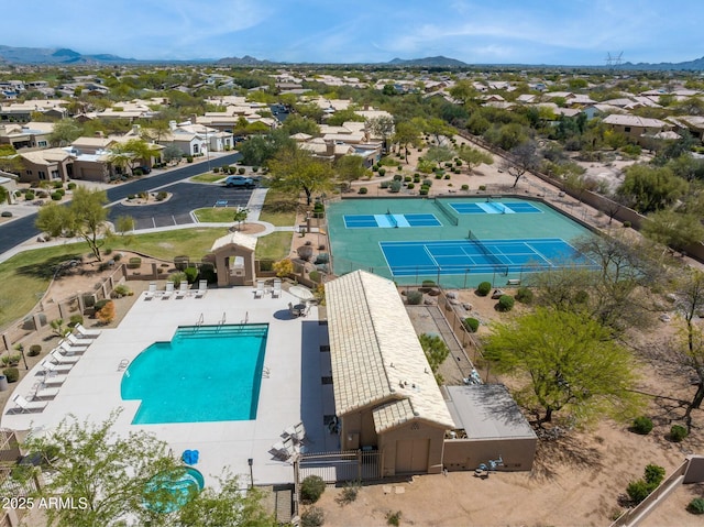 birds eye view of property with a mountain view