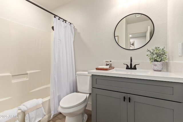 full bathroom with vanity, toilet, and shower / bath combo with shower curtain