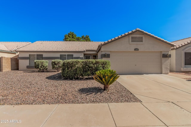 3343 W Lone Cacuts Dr, Phoenix, AZ 85027 - ranch-style house featuring concrete driveway, stucco siding, an attached garage, and a tiled roof