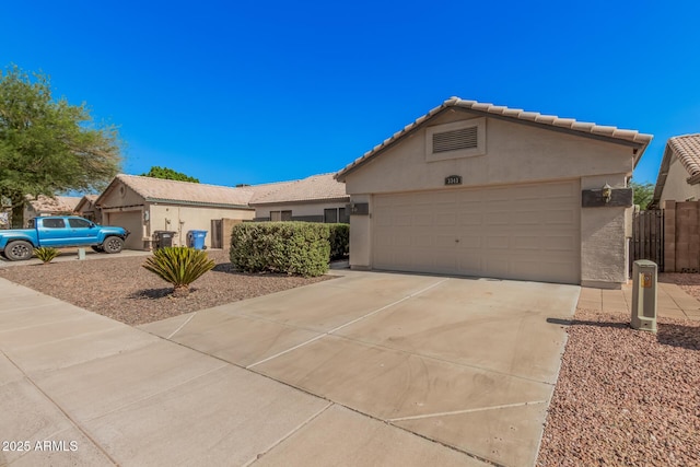 3343 W Lone Cacuts Dr, Phoenix, AZ 85027 - ranch-style home featuring stucco siding, a garage, concrete driveway, and a tiled roof