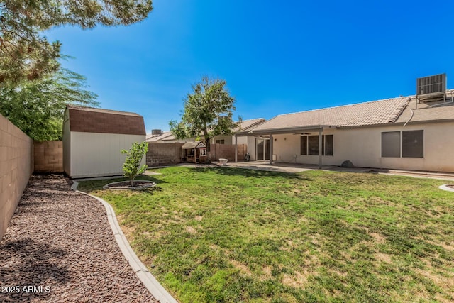 3343 W Lone Cacuts Dr, Phoenix, AZ 85027 - fenced backyard with a shed, a patio area, and a ceiling fan