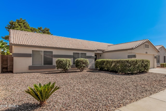 3343 W Lone Cacuts Dr, Phoenix, AZ 85027 - ranch-style house with an attached garage, a tile roof, and stucco siding