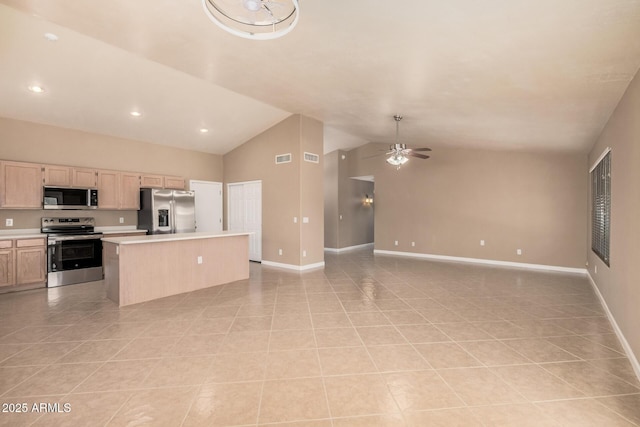 3343 W Lone Cacuts Dr, Phoenix, AZ 85027 - kitchen with stainless steel appliances, light tile patterned floors, a kitchen island, light countertops, and a ceiling fan