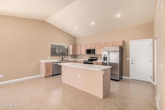 3343 W Lone Cacuts Dr, Phoenix, AZ 85027 - kitchen featuring stainless steel appliances, light brown cabinetry, a center island, light countertops, and light tile patterned flooring