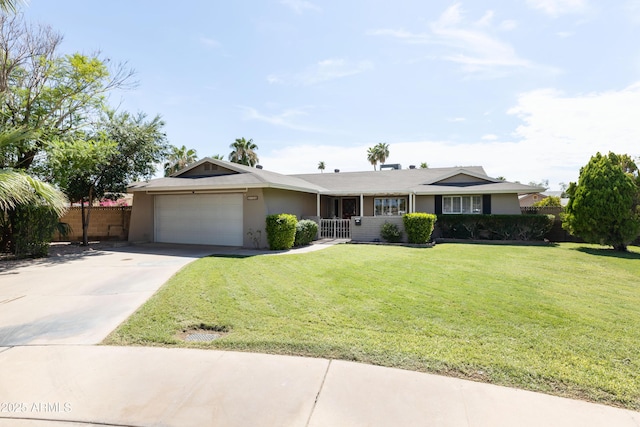 single story home featuring a garage and a front lawn