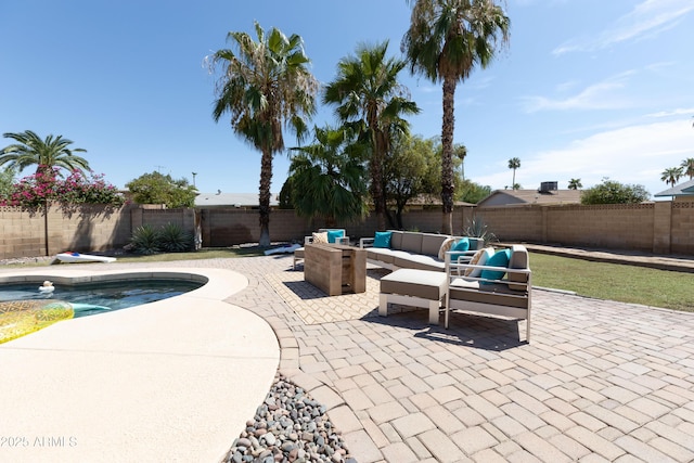 exterior space with an outdoor hangout area and a fenced in pool