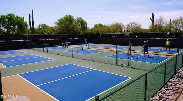 view of sport court featuring basketball hoop