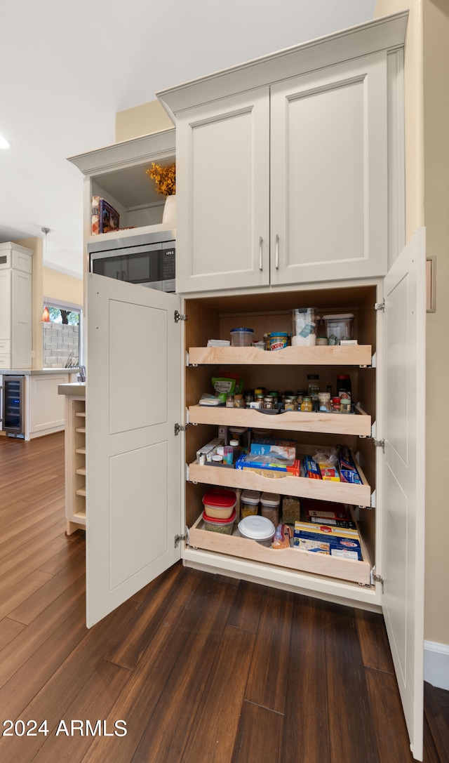 pantry featuring wine cooler