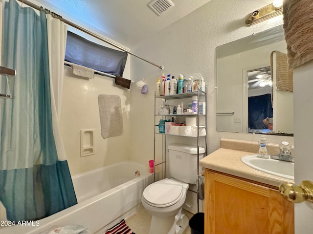 full bathroom with shower / bath combo with shower curtain, toilet, and vanity