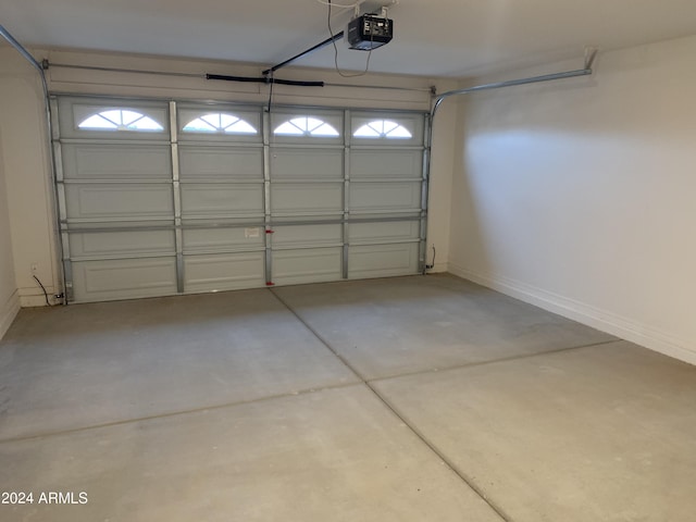 9987 W Verde Ln, Avondale, AZ 85392 - garage with baseboards and a garage door opener