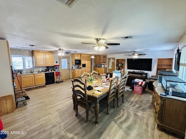 2185 W Greasewood St, Apache Junction, AZ 85120 - dining room with light wood-style floors and ceiling fan